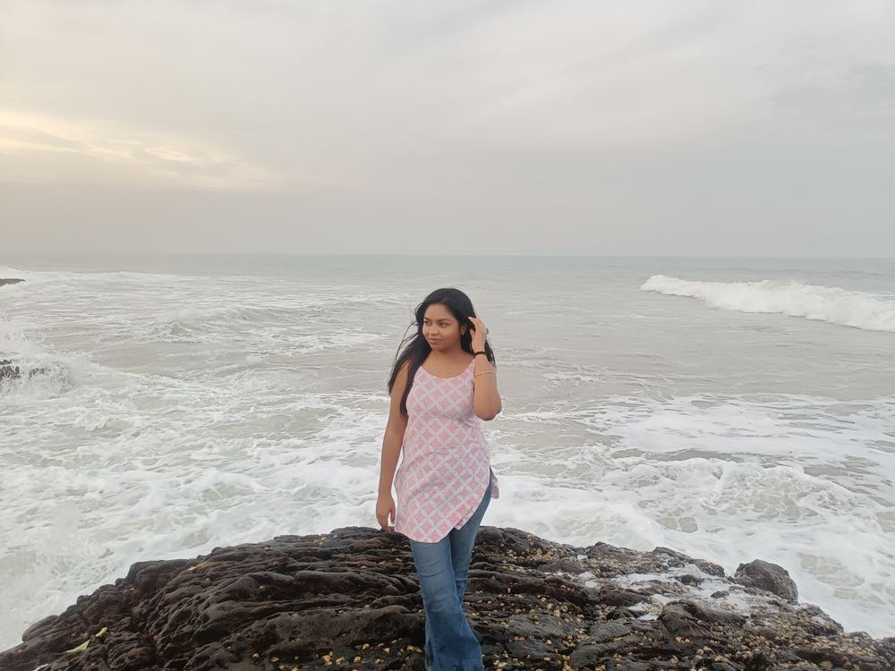 Shruti looking off to the side, deep in thought